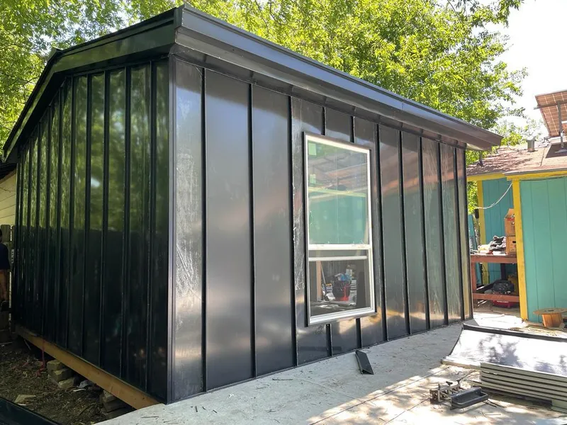 Black standing seam metal wall panels for Roof Inspection in Sheffield Lake